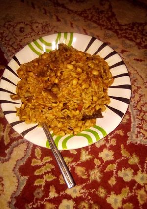 A picture of Jollof Rice 🍚 and Beans.