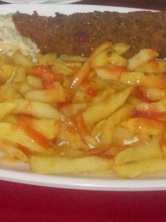 A picture of Potato fries with kebab.