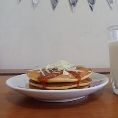 A picture of Buttermilk Pancake with Caramel and Cheese Topping.