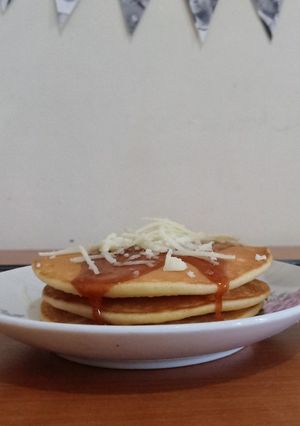 A picture of Buttermilk Pancake with Caramel and Cheese Topping.