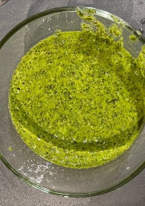 A picture of Roasted chicken spaghetti squash and pesto.