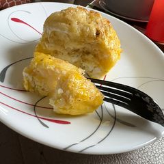 A picture of Pancake and egg breakfast sandwich.