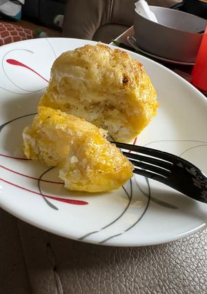 A picture of Pancake and egg breakfast sandwich.