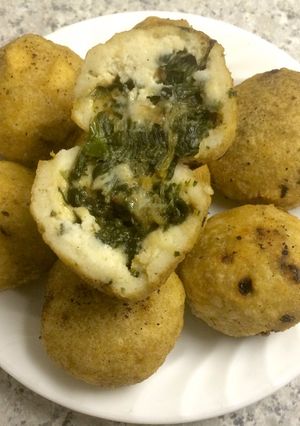 Una foto de Bolitas de maíz rellenas de espinaca y calabaza