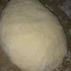 A picture of Pizza dough with yogurt.