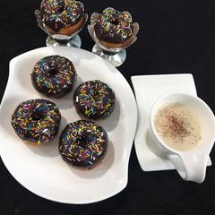 A picture of Chocolate Donuts 🍩 With Capachino Coffee.