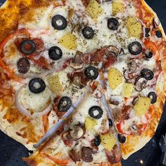 A picture of Chicken With Veggie Cheese pizza.