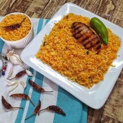 A picture of Peri Peri Rice with peri peri Chicken.