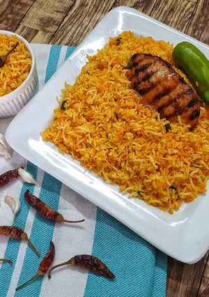 A picture of Peri Peri Rice with peri peri Chicken.