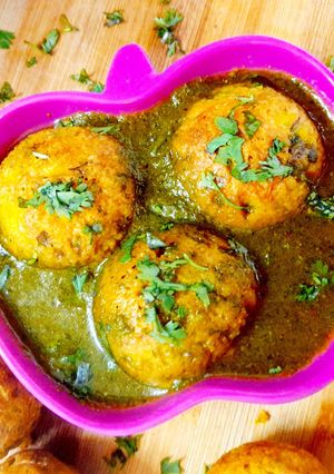 A picture of Moong dal Dumplings In Spinach Tomato soup.