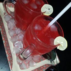 A picture of Rooh afza and lemon juice.