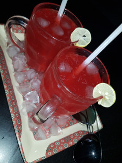 A picture of Rooh afza and lemon juice.