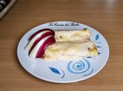 Una foto di cannelloni al forno