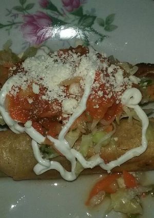 Una foto de Tacos dorados
