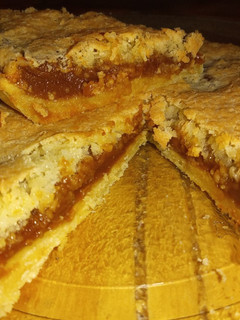 Una foto de Tarta de dulce de leche y coco con grasa