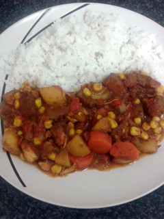 A picture of carribean chicken curry & rice.