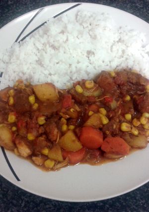 A picture of carribean chicken curry & rice.