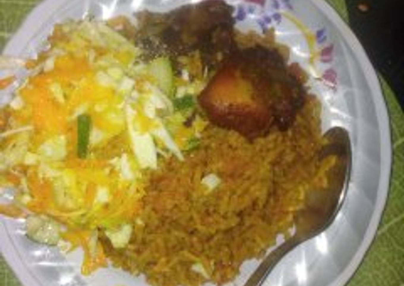 Jollof rice with fried chicken and salad with heinz salad cream and sprinkled sugar