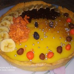 A picture of Fruit custard tart.