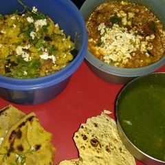A picture of Leftover​ Rice briyani and mix Soyabean veg subji with paratha.