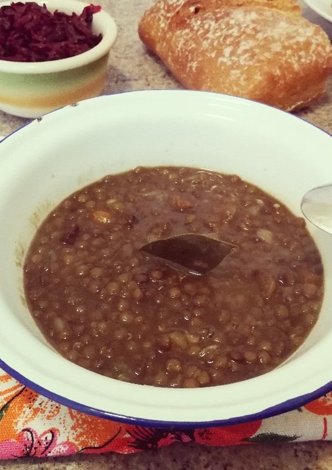 Una foto de Cocido de lentejas pardinas con tocino ahumado