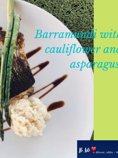A picture of Barramundi with cauliflower rice and asparagus.