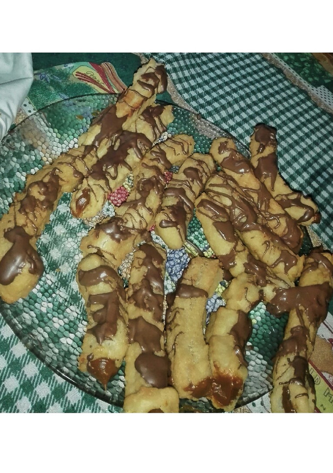 Una foto de Churros con chocolate rellenos de dulce de leche 😎