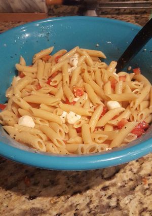 A picture of Tomato and mozzarella penne pasta.