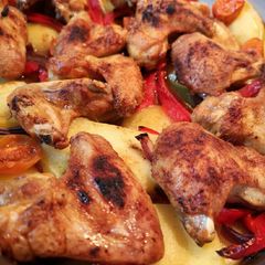 A picture of One pan roast spicy chicken wings meal.