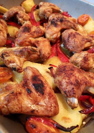 A picture of One pan roast spicy chicken wings meal.