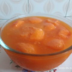 A picture of Komola Bhog - orange flavoured Roshogolla/Rasgulla.