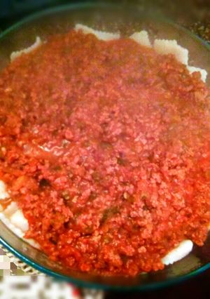 Una foto de Ravioles con salsa bolognesa