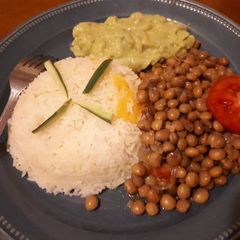 Pigeon peas served with rice and guacamole A picture of Pigeon peas served with rice and guacamole.