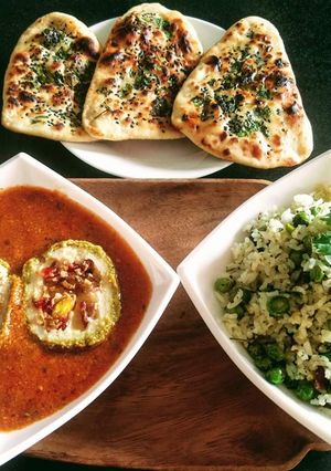 A picture of Matar Paneer Koftas, tawa coriander naan with methi matar pulao.