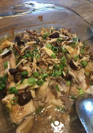 A picture of Tilapia with mushrooms.