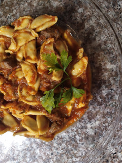 Una foto de Tortellini con tuco