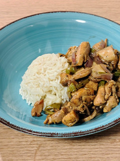 A picture of Chicken Wok with Mushrooms and Black Garlic.