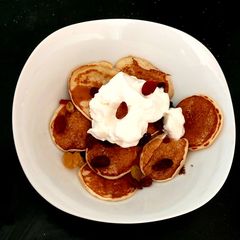 A picture of My Tiny Pancakes, Dried fruit & Greek plain yogurt bowl.