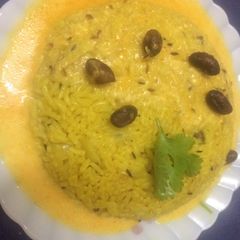 A picture of Rajasthani kadhi with masala rice.