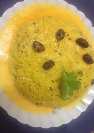 A picture of Rajasthani kadhi with masala rice.