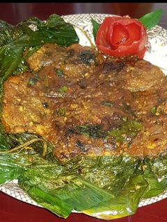 A picture of Fish fry with turmeric leaves.