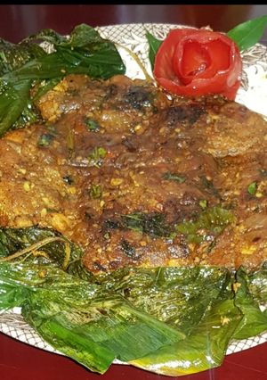 A picture of Fish fry with turmeric leaves.