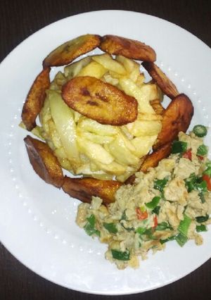 A picture of Fry Irish potatoes, plantain with scrambled egg.