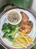 92. Pan-seared garlic chicken served with creamy mushroom sauce & broccoli potatoes