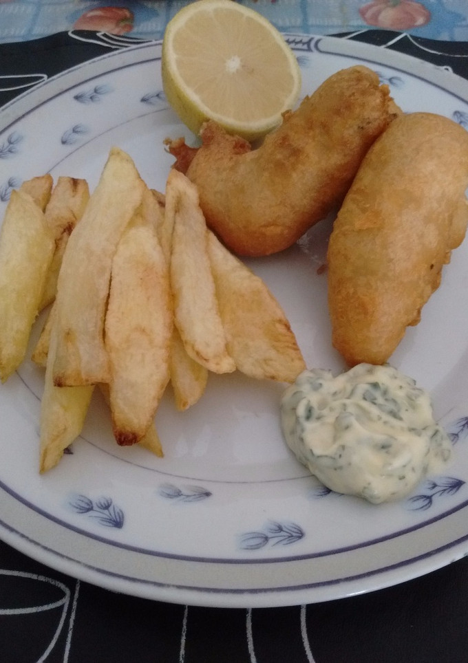 Una foto de Pescado frito con papas