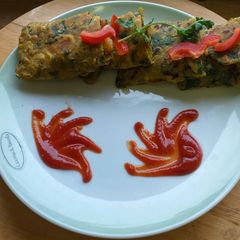 A picture of Palak paratha stuffed with veggies.