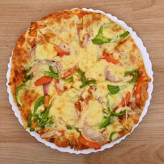 A picture of Fusion Pizza with Szechuan pepper.