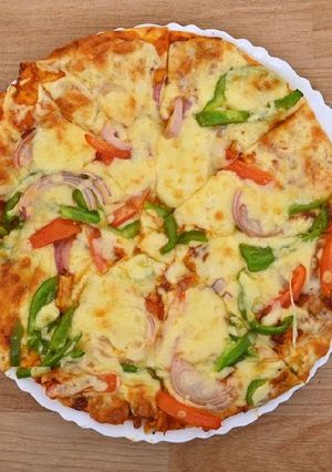A picture of Fusion Pizza with Szechuan pepper.