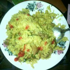 A picture of Brown rice with meat.