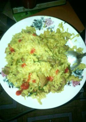 A picture of Brown rice with meat.
